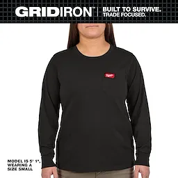 The Women's GRIDIRON™ Pocket T-Shirt - Long Sleeve Black is shown, modeled by a person wearing a size small. The shirt features a front pocket with a red logo patch and is designed for durability. The model is 5'1" tall.