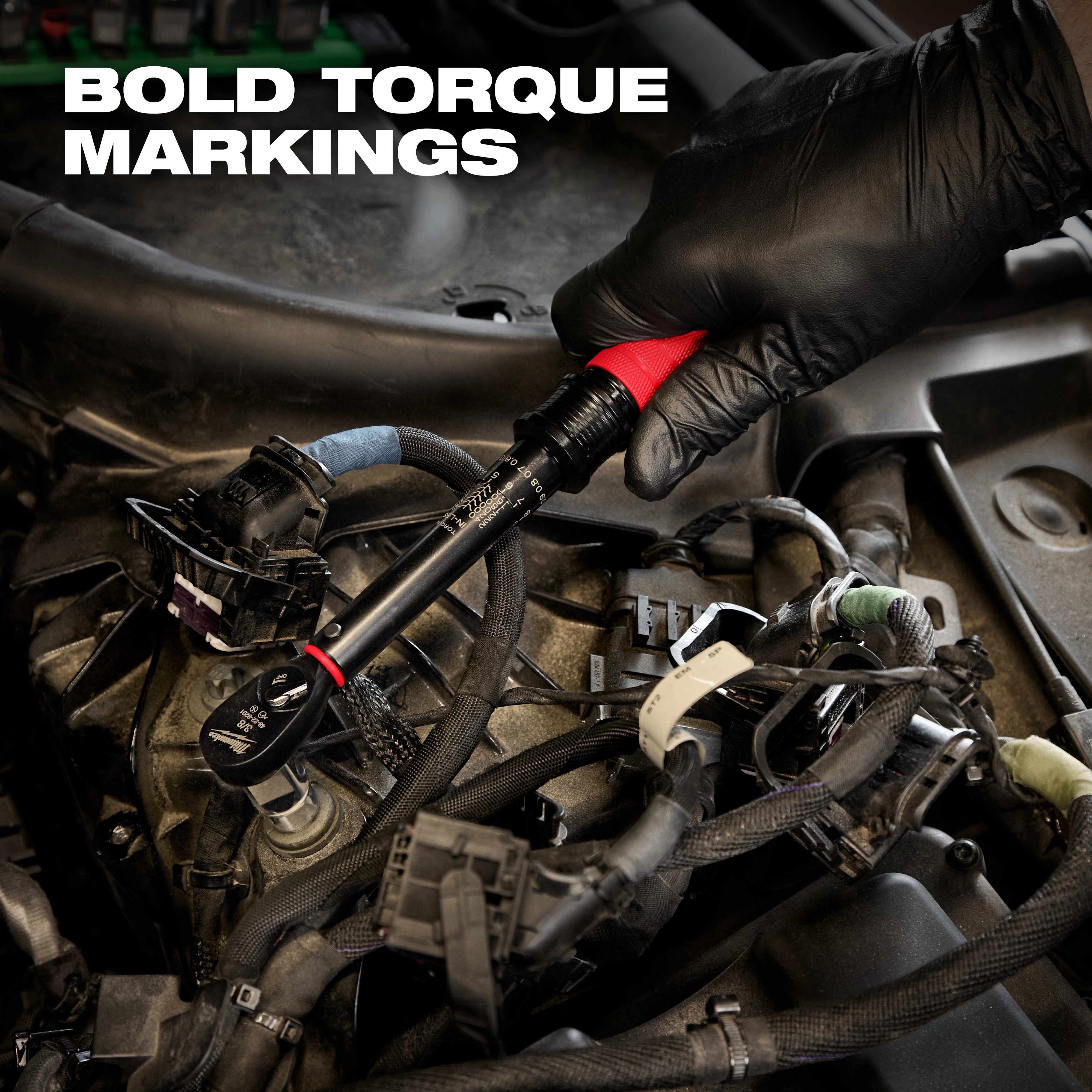 A gloved hand holds a 3/8” Drive Click Torque Wrench (50-250 in·lbf) amidst car engine components. Bold torque markings are visible.