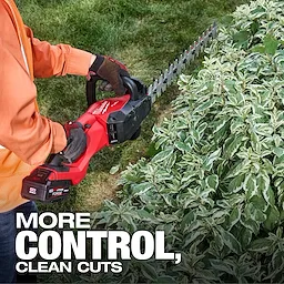 A person trims hedges using the M18 FUEL™ 24" and 30" Hedge Trimmer. The text "MORE CONTROL, CLEAN CUTS" appears at the bottom. The tool is held horizontally, and the hedge has variegated green leaves.