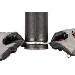 A person wearing gray and black work gloves is holding a black cylindrical pipe, fastening a silver adjustable clamp around its base. The image focuses on the hands, gloves, and the clamp against a white background.