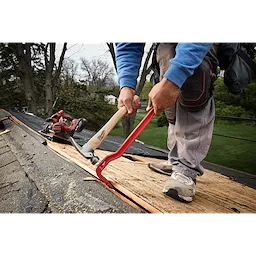 Worker using a 16oz Smooth Face Hickory Handle Hammer and pry bar on roof decking.