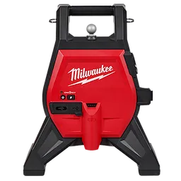 The image shows the M12™ Compact Drain Line Inspection Powered Base, featuring a red and black housing with the Milwaukee logo. It has a handle at the top, a central control panel with various ports and buttons for connectivity, and sturdy legs for support.