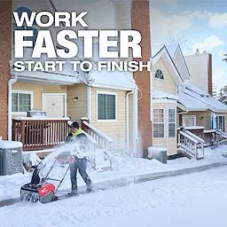 A person uses the M18 FUEL™ 21" Auger Propelled Dual Battery Single Stage Snow Blower to clear snow in front of a house. The text "Work Faster Start to Finish" is displayed on the image.
