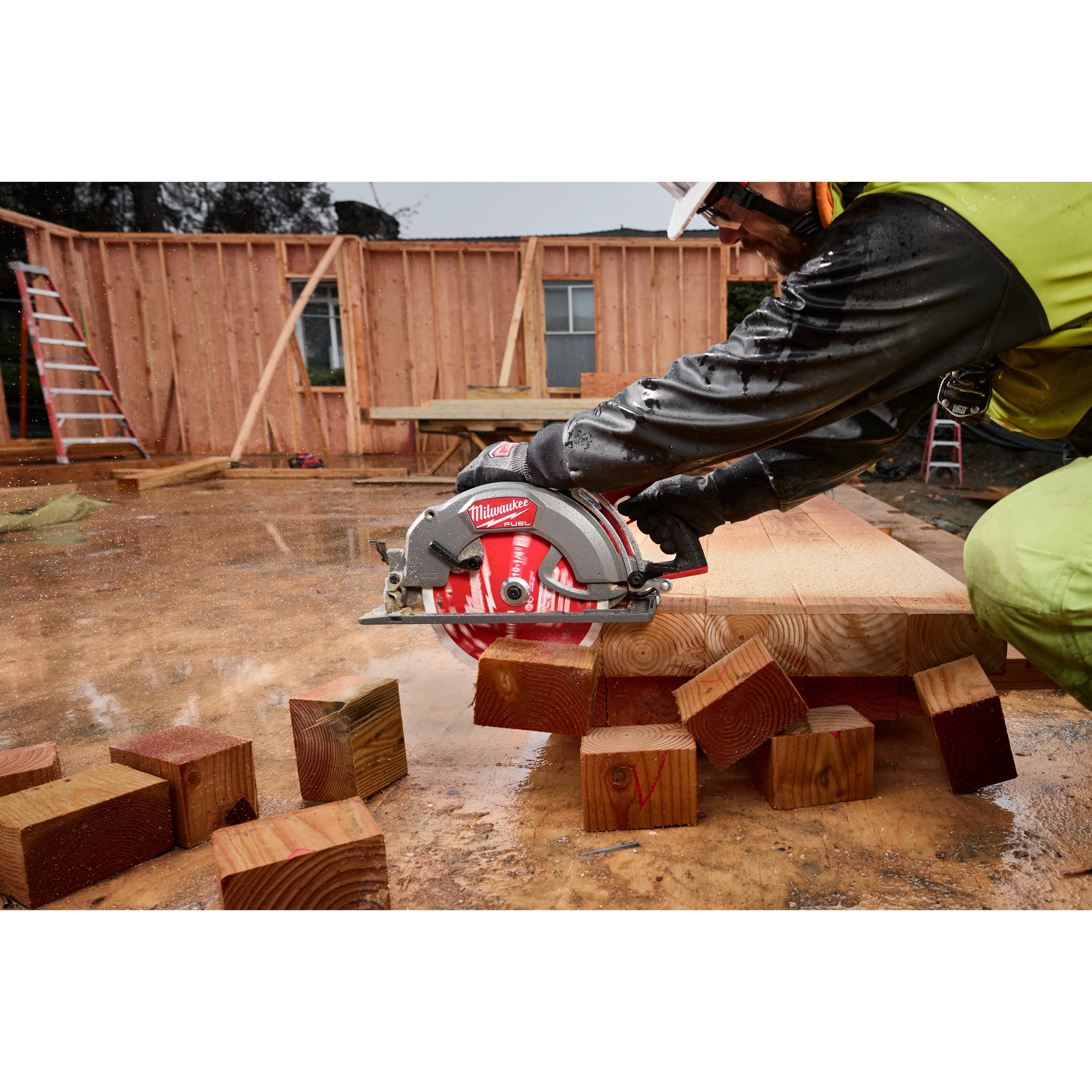 Worker using a circular saw with the 10-1/4” 28T Thick Kerf Framing Circular Saw Blade on a wet construction site.