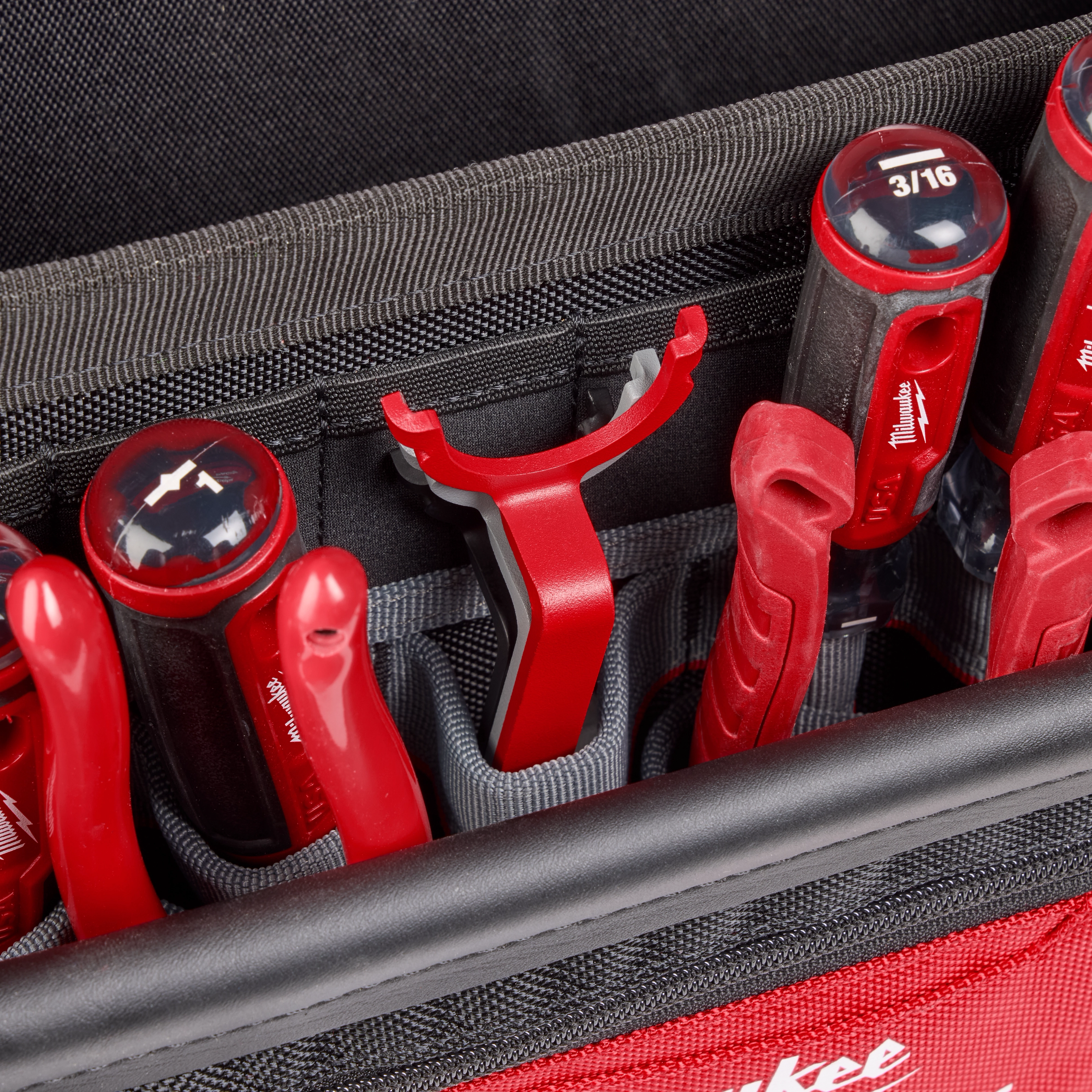 The 3 PC Locknut Wrench Set, featuring black and red tools with 3/16" size markings, is organized in a black and red tool case. The set includes ergonomic red-handled wrenches.