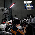 Image of a mechanic using the Milwaukee M18 Magnetic Extendable Boom Light on the jobsite