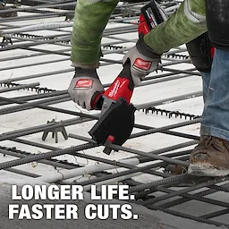 A construction worker uses a Milwaukee power tool equipped with a #10 (1-1/4”) Rebar Cutting Blade to cut through rebar on a job site. The text "LONGER LIFE. FASTER CUTS." appears at the bottom of the image.