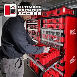 A person organizes tools into a Milwaukee PACKOUT™ Rack system in a vehicle. The red and black PACKOUT™ containers are securely stacked and arranged for easy access. The text "ULTIMATE PACKOUT ACCESS" is displayed in the corner.