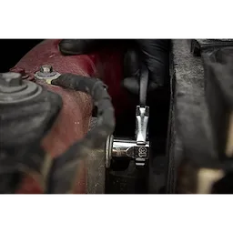 A gloved hand uses a ratchet and socket from the 98pc 3/8" 6-Pt and 12-Pt Metric & SAE Ratchet & Socket Set with PACKOUT™ Low Profile Organizer to tighten a nut on a vehicle part.