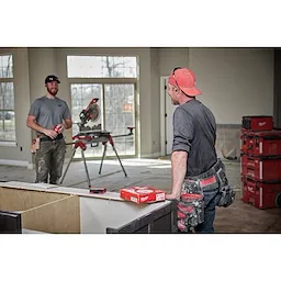 Worker wearing the Bluetooth ear buds on the jobsite