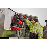 Image of a worker using the Milwaukee PACKOUT Structured Backpack on the jobsite