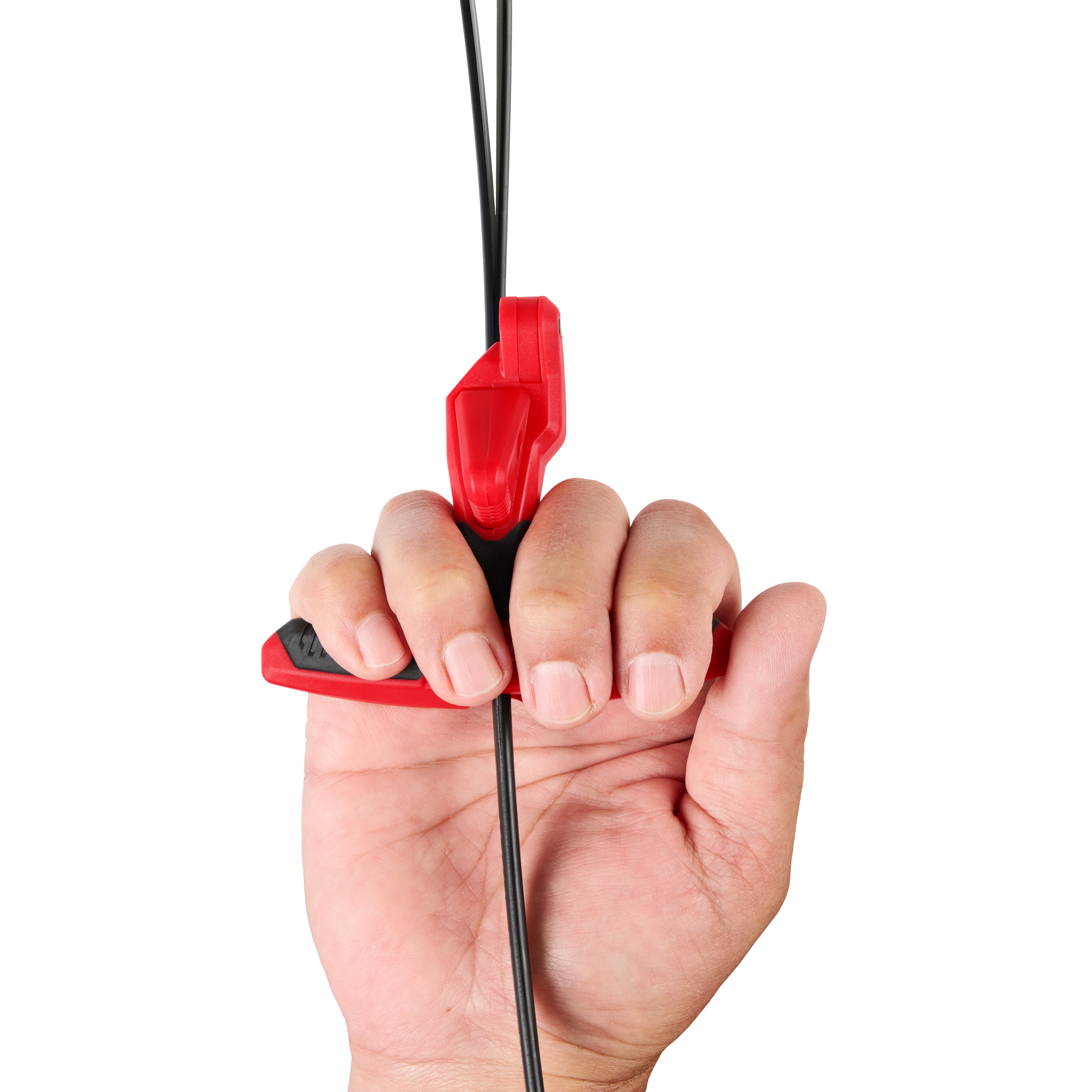 A hand gripping a red and black tool with a cable running through it.