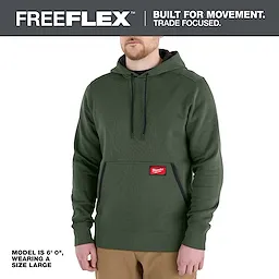 Model wearing a green FREEFLEX Pullover Hoodie with front pocket and drawstring hood.
