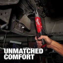 The M12 FUEL™ 3/8" Ratchet is held by a person working under a vehicle, showcasing its ergonomics and design. The background text reads "UNMATCHED COMFORT."