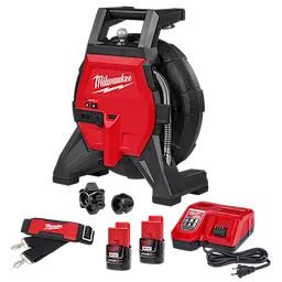 This image shows a Milwaukee drain snake kit, including the main red and black snake device, two M12 batteries, a charger, two attachment heads, and a strap.