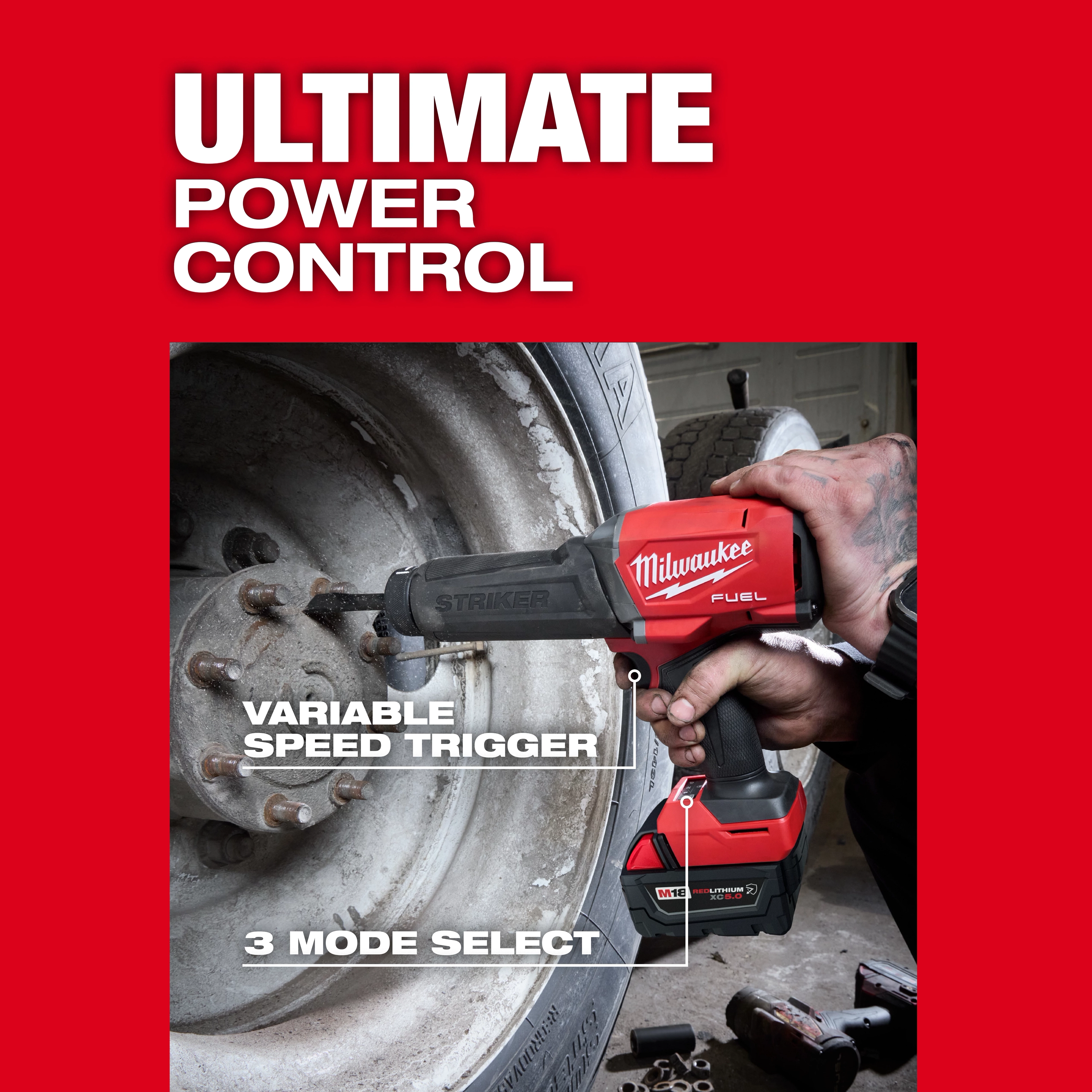 M18 FUEL STRIKER Hammer Chisel loosening lug nuts on a vehicle wheel in a workshop setting