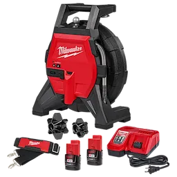 The image shows a Milwaukee drain cleaning machine set. It includes a red and black drain cleaner, a battery charger, two M12 batteries, two cable attachments, and a strap with a Milwaukee logo. The main device has a coiled cable and a handle on top.