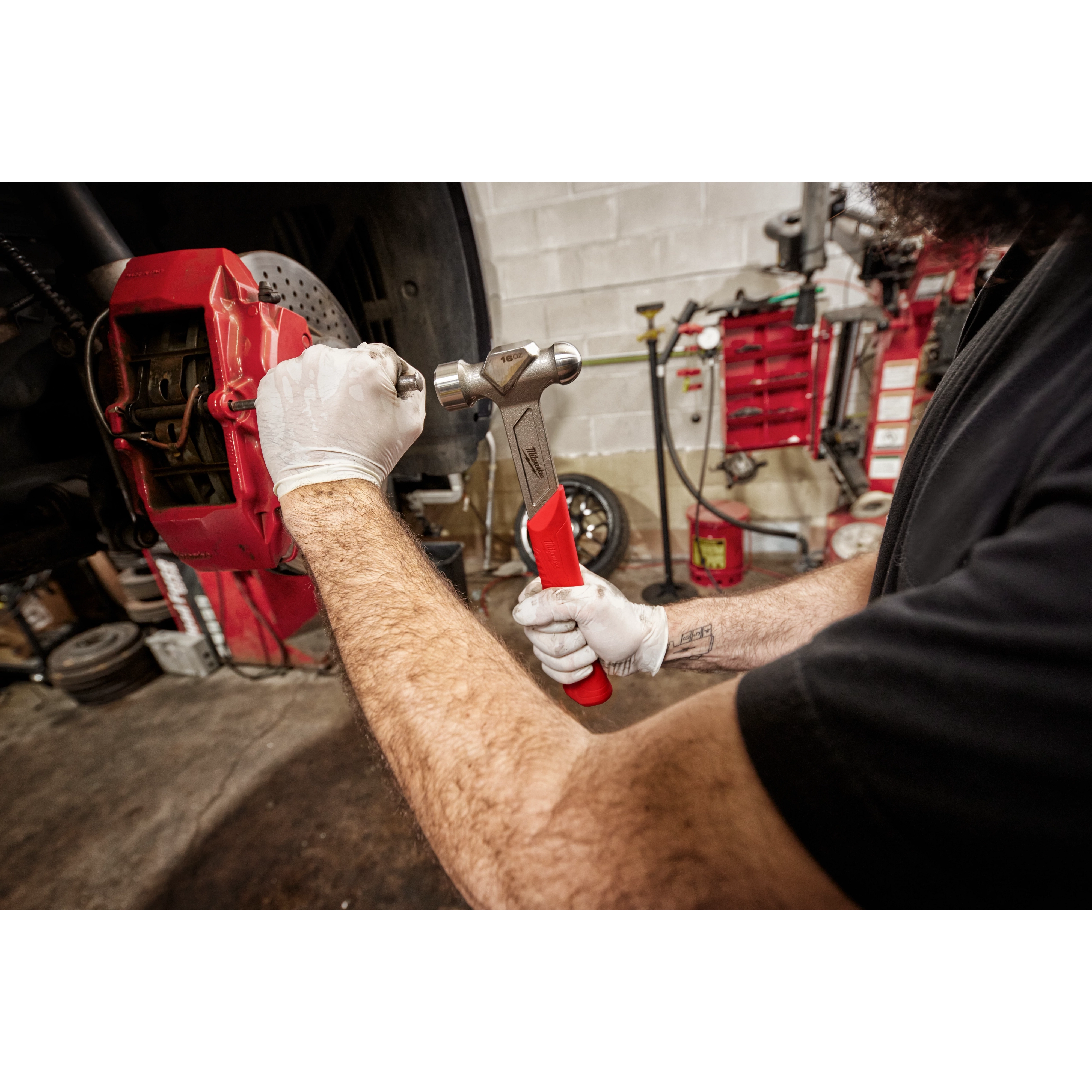Worker using the 16oz Steel Ball Peen Hammer