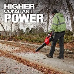 Person using a red leaf blower on a sidewalk with "Higher Constant Power" text above.