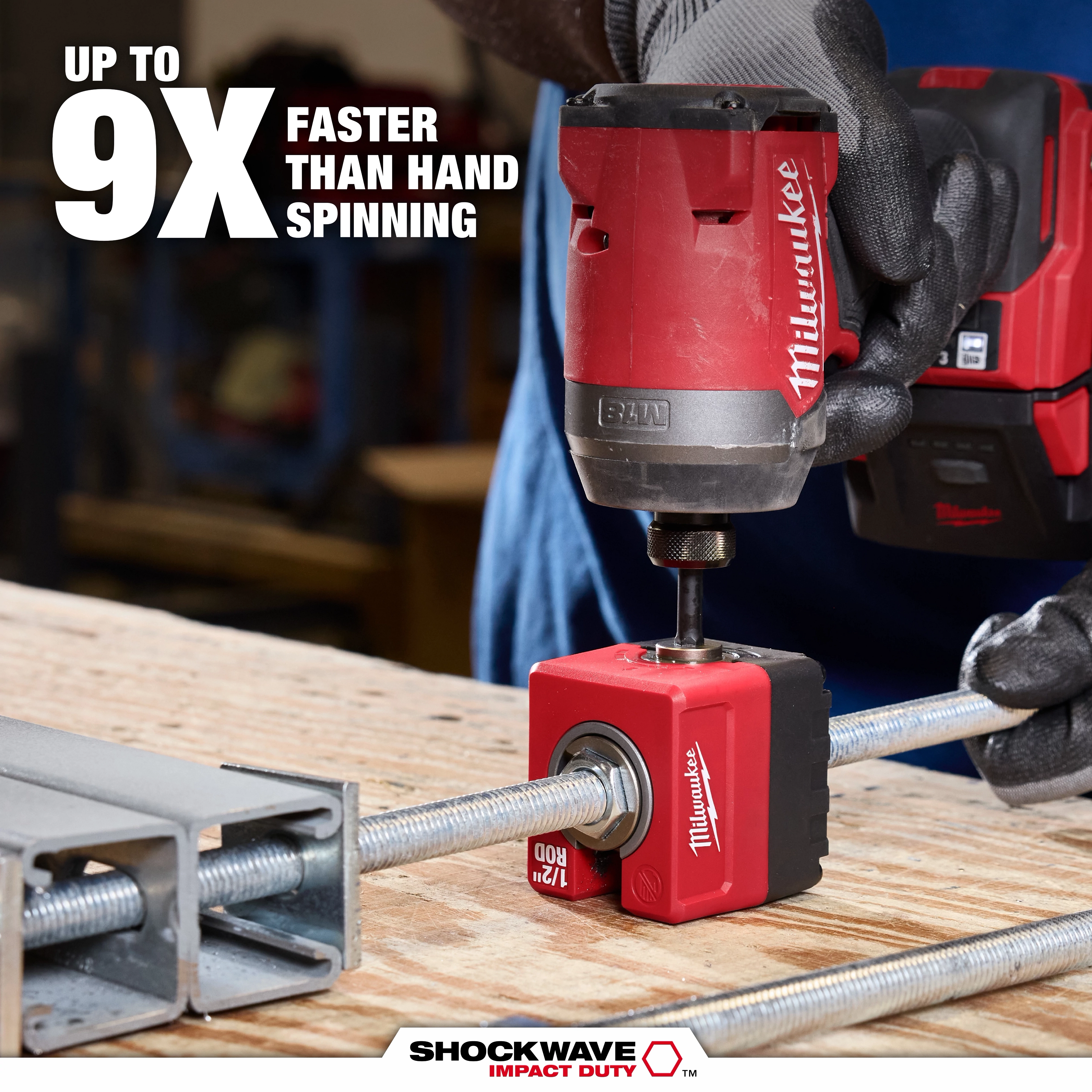 SHOCKWAVE Impact Duty 1/2" Threaded Rod Nut Runner attached to a threaded rod on a workbench.