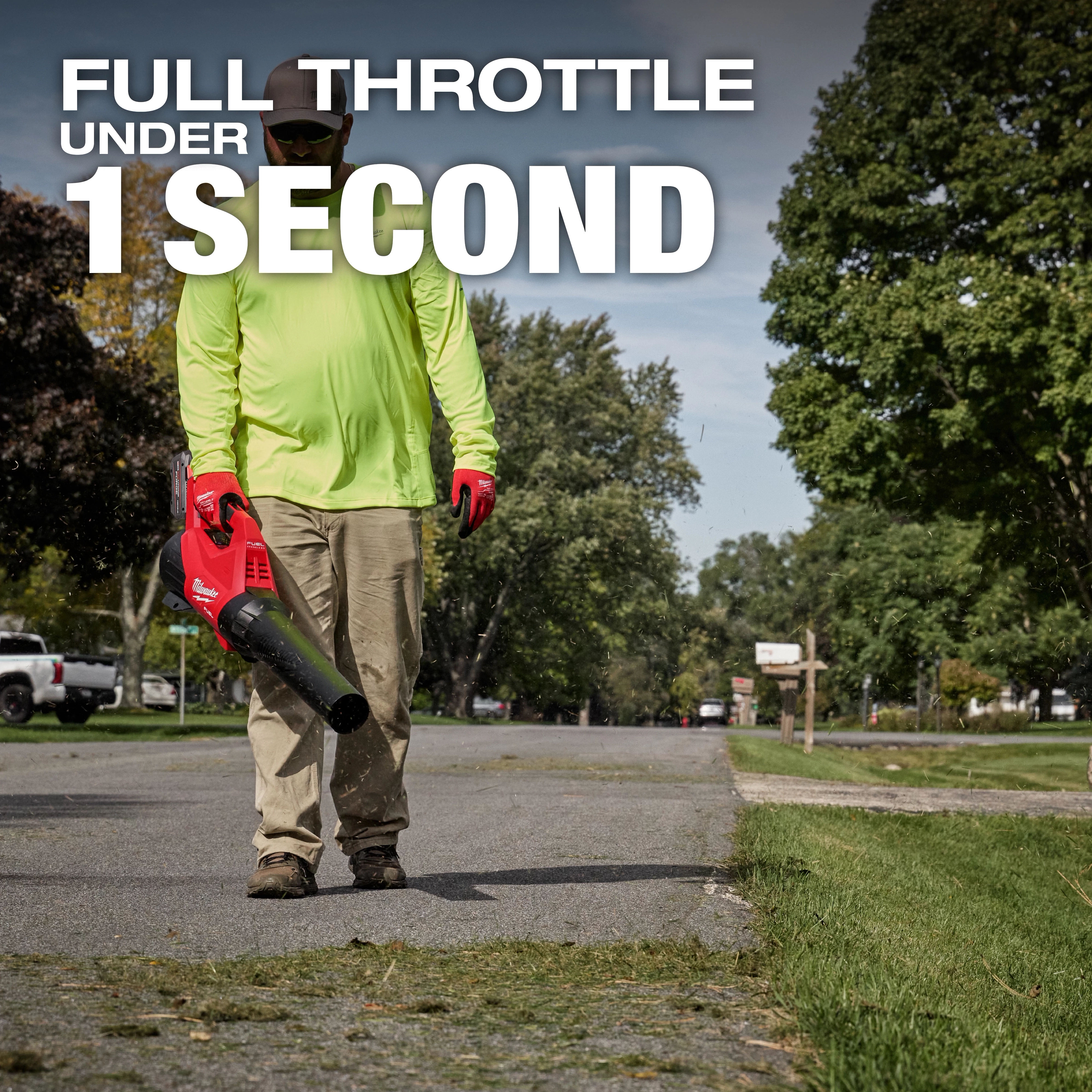 Person using a red leaf blower with text: "FULL THROTTLE UNDER 1 SECOND."