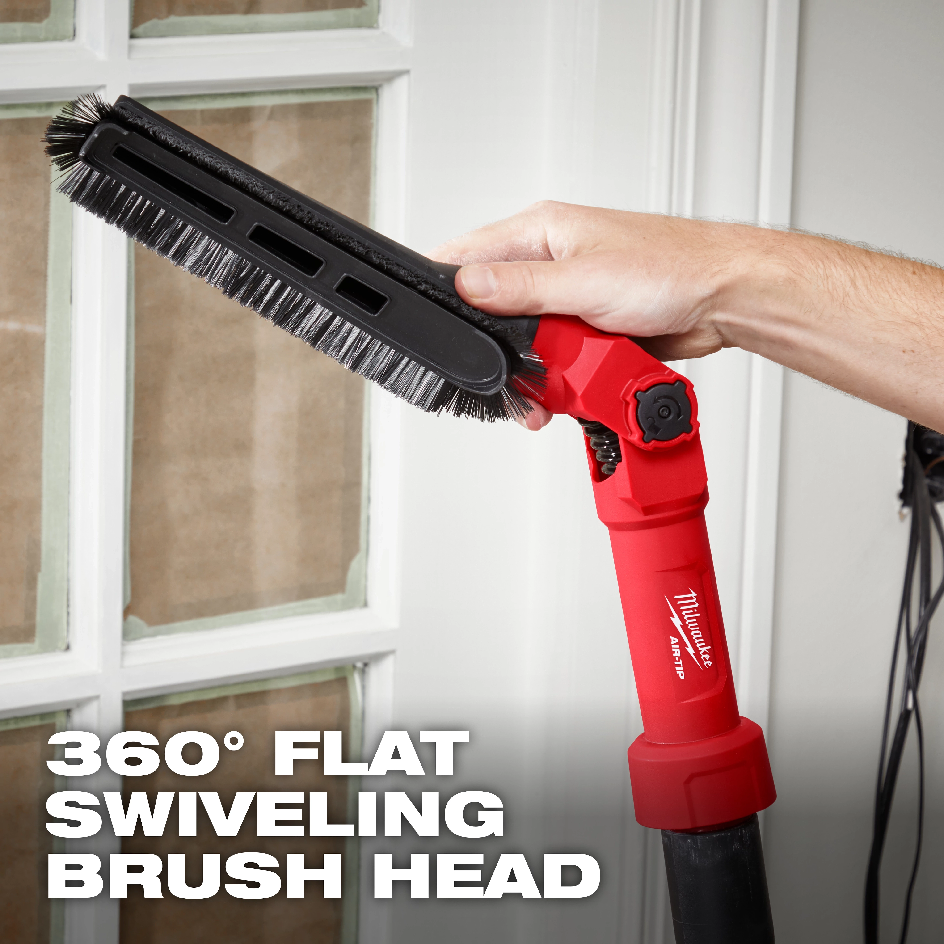 A person is holding the AIR-TIP™ Low-Profile Pivoting Brush Tool, which features a 360° flat swiveling brush head. The tool has a red handle and is being used to clean a window frame. The large text at the bottom reads "360° FLAT SWIVELING BRUSH HEAD".