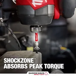 The image shows a close-up of the SHOCKWAVE™ SHOCKZONE™ TORX® Bit being used with a power tool. The bit is red and has "SHOCKWAVE IMPACT DUTY™" written on it. The text claims "SHOCKZONE™ absorbs peak torque" at the bottom of the image.