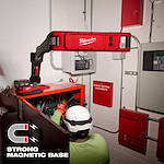 Image of a worker using the Milwaukee M18 Magnetic Extendable Boom Light on a jobsite with the text "Strong Magnetic Base"