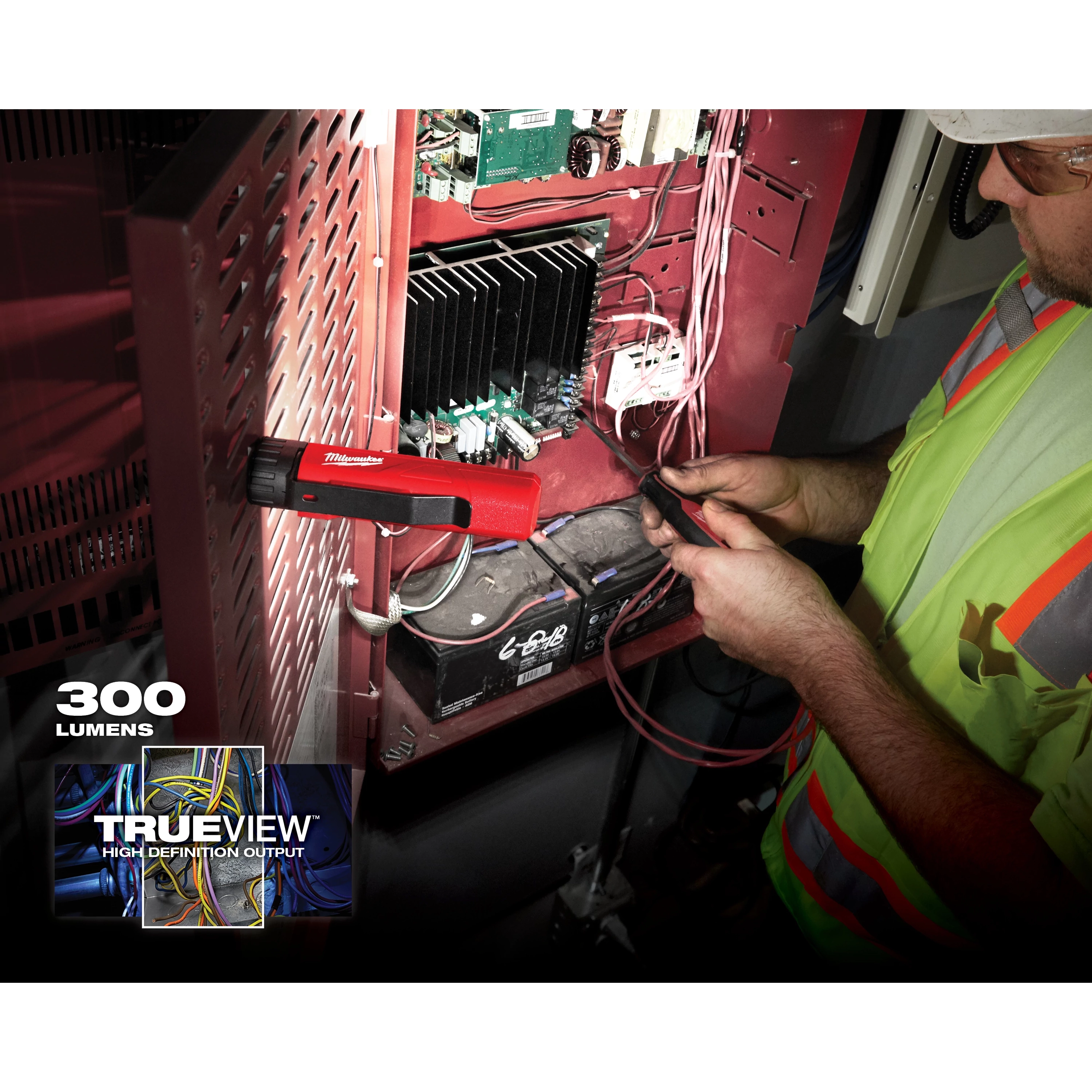 Person working on electrical panel with App%20Shot%20with%20overlay work light, illuminating with 300 lumens and TrueView high definition output.