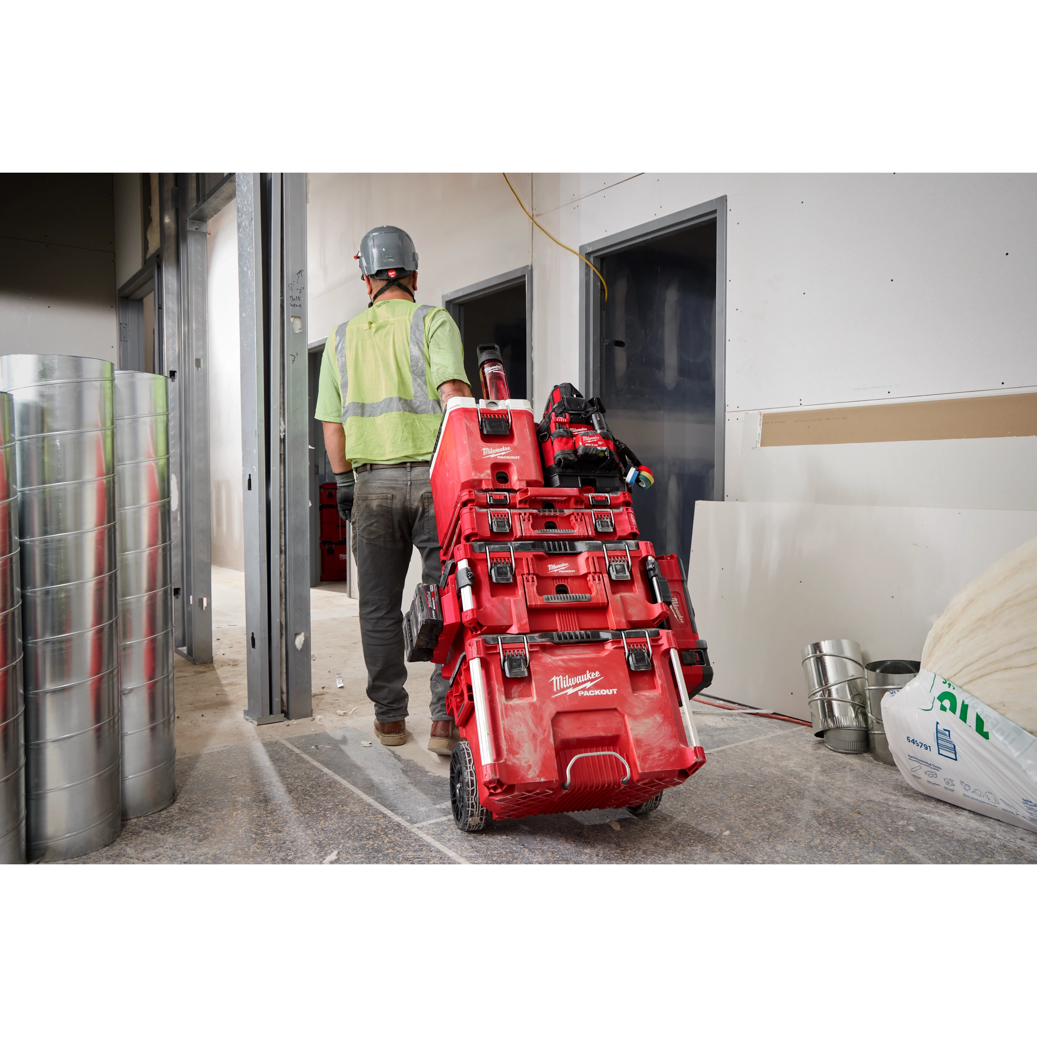 The PACKOUT™ 25oz Bottle with Chug Lid is a robust, stainless steel water bottle designed for durability and convenience. It features a large chug lid for easy drinking and a sturdy handle for carrying. The red-colored body has a textured grip for a secure hold. The lid is black with a flip-top chug spout and a locking mechanism to prevent leaks. This bottle is ideal for keeping beverages cold or hot during work or travel.