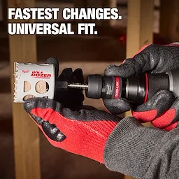 The QUIK-LOK™ Arbor Set is being held in gloved hands, attached to a drill with a Hole Dozer bit. The product is marketed as having "Fastest Changes" and "Universal Fit."
