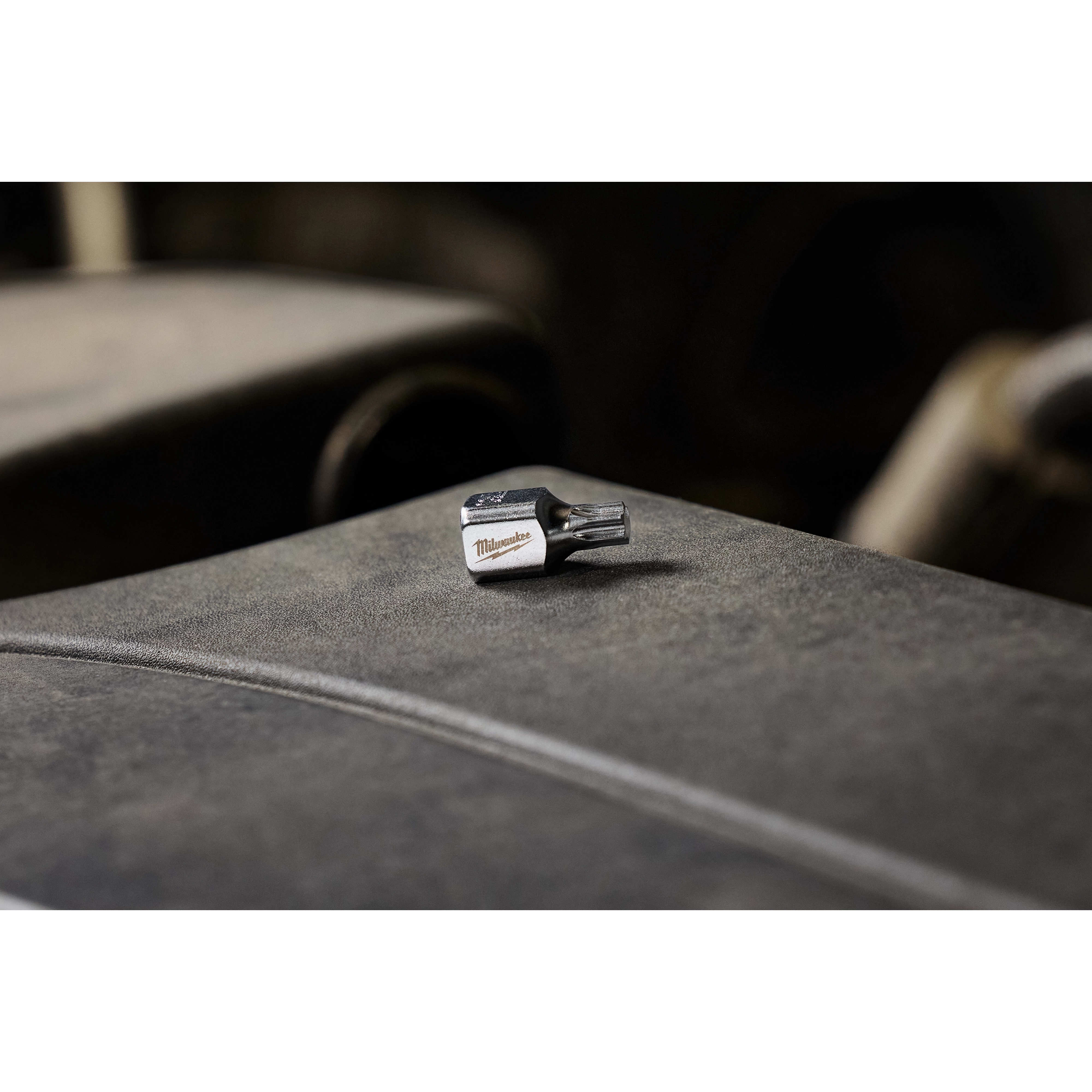 1/4" Drive T30 Low-Profile TORX Bit Socket placed on a dark, textured surface. Suited for use in tight spaces and various applications.