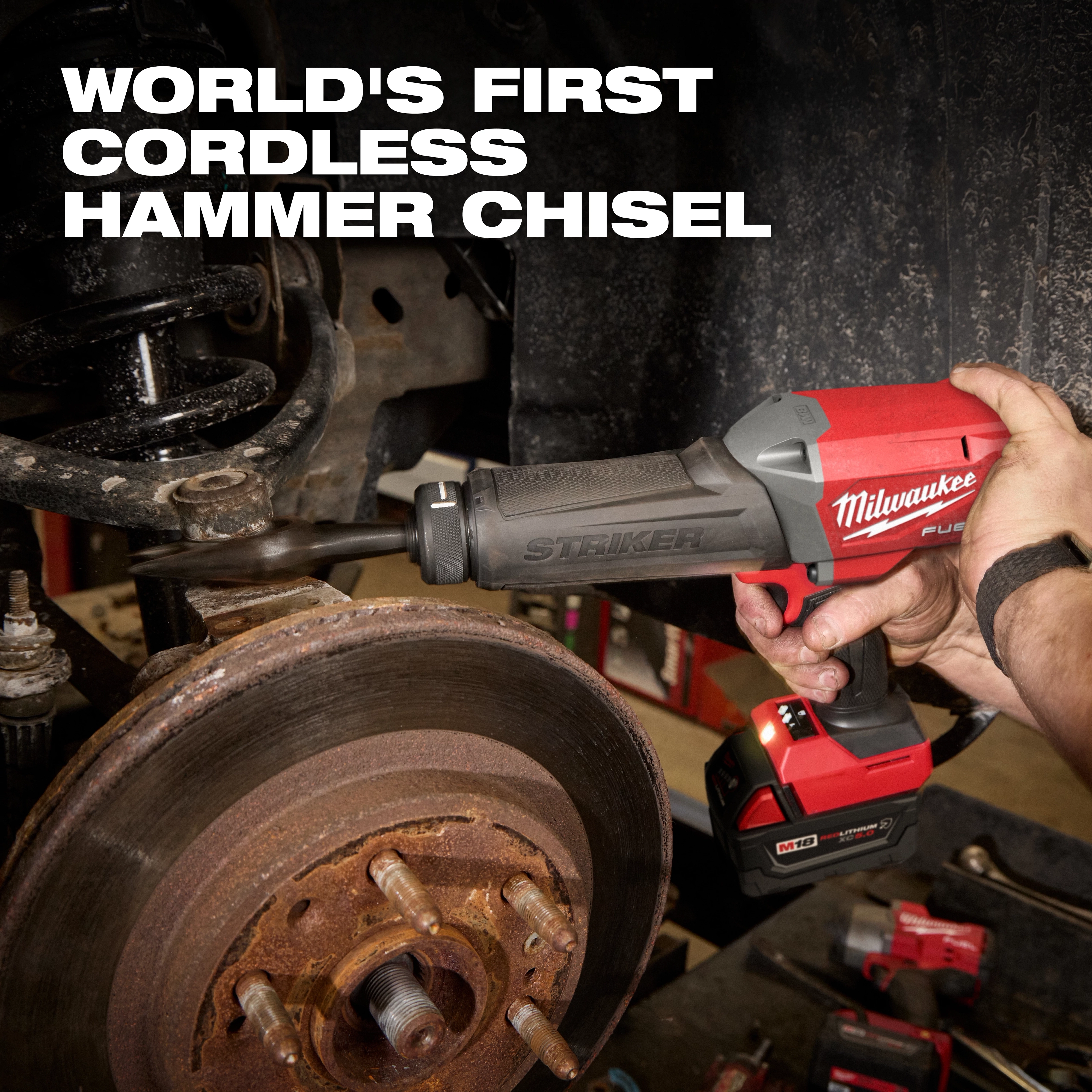 M18 FUEL STRIKER Hammer Chisel in use on a vehicle brake assembly in a workshop setting