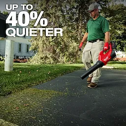Person using a red leaf blower on a driveway with text "UP TO 40% QUIETER" in the upper left corner.
