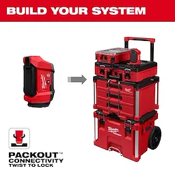 M12™ ROVER™ Multi-Directional Flood Light w/ PACKOUT™ Compatibility is shown with a modular tool storage system. The light connects to red PACKOUT™ cases with a twist-to-lock mechanism. The image includes the slogan "Build Your System" and indicates the stackable nature and secure connectivity of the PACKOUT™ products.