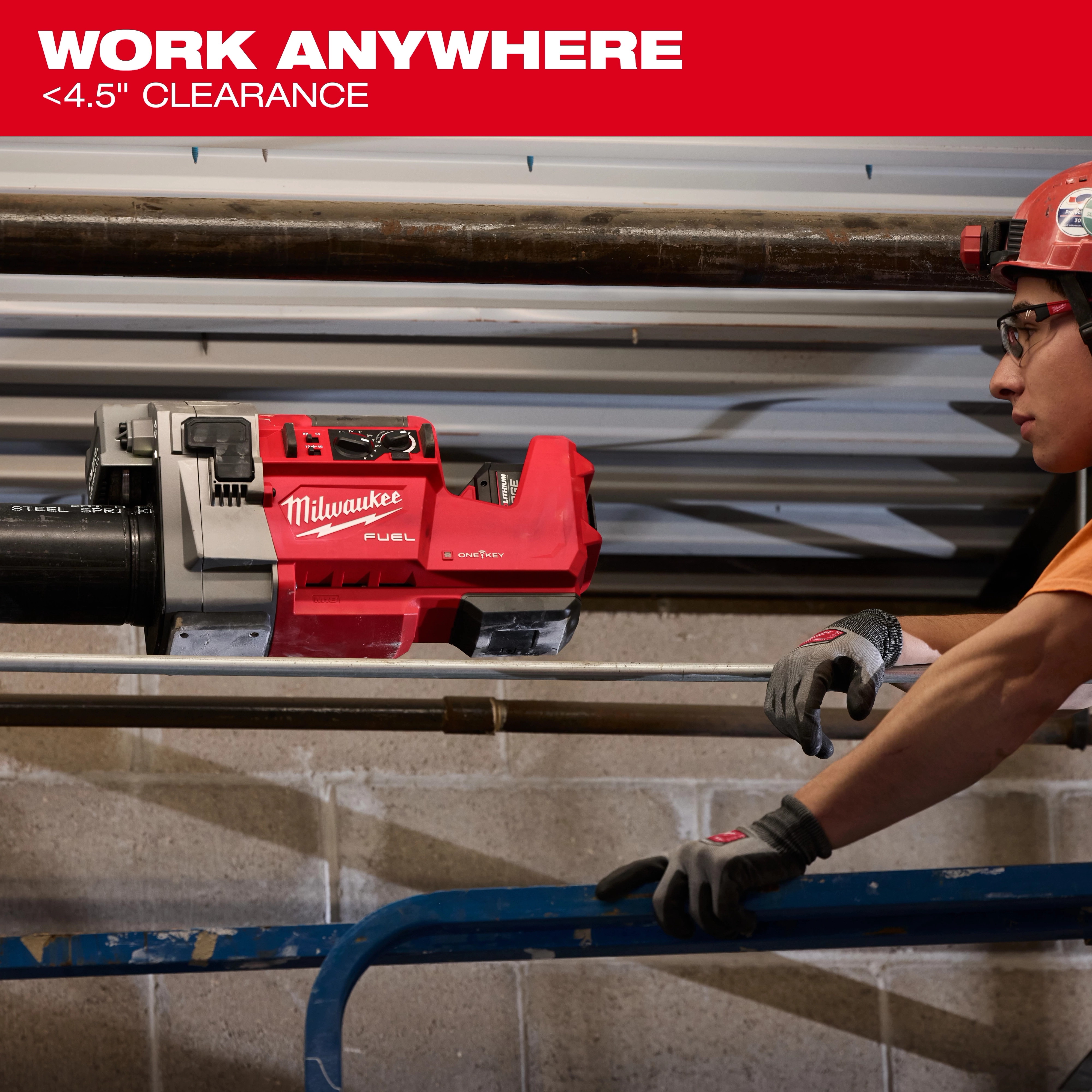 The image shows an M18 FUEL™ RINGER™ Roll Groover by Milwaukee being used on a pipe with under 4.5 inches of clearance.