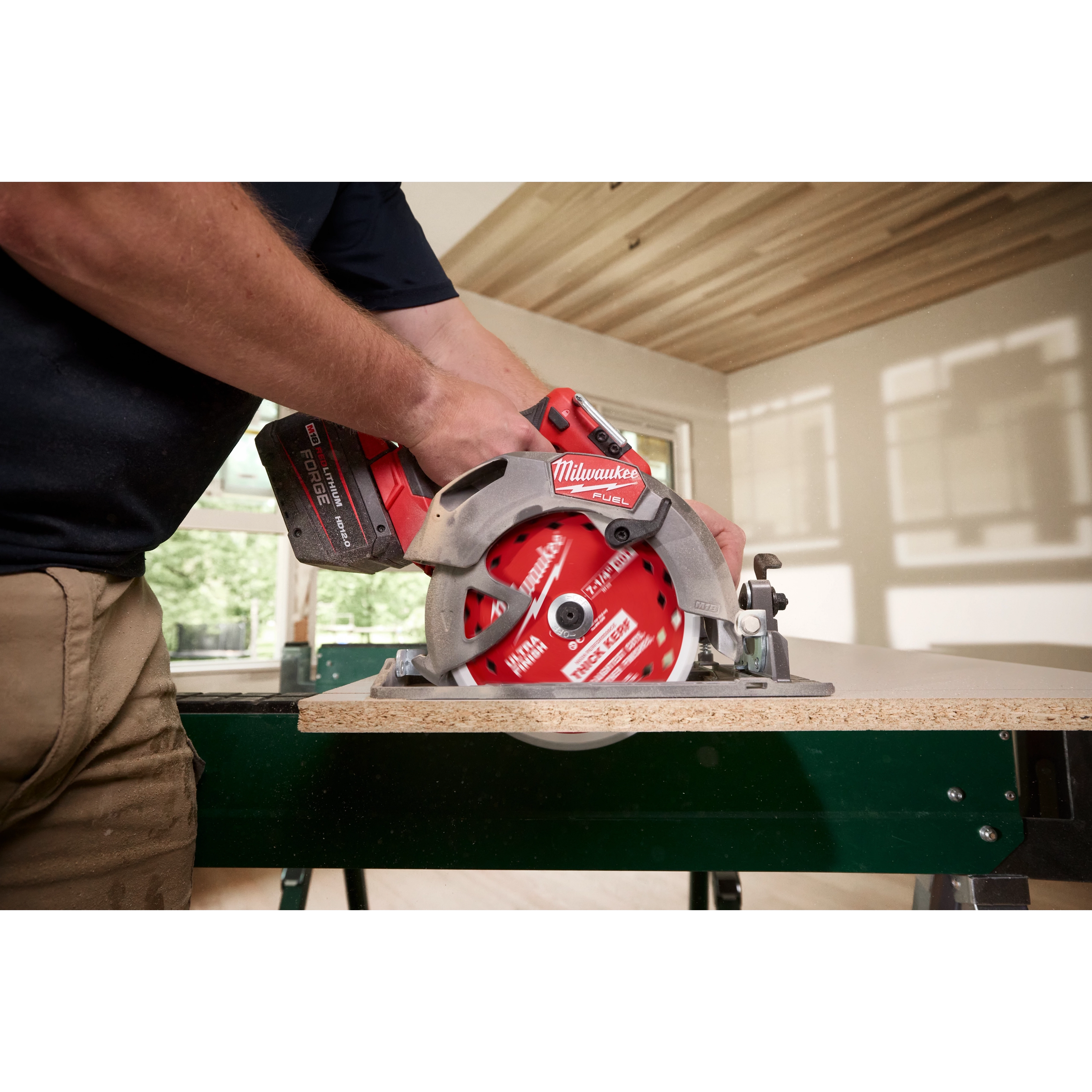 7-1/4" 60T Thick Kerf Ultra Finish Circular Saw Blade mounted on a circular saw cutting a board on a workbench.
