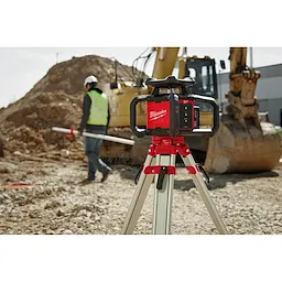 The Red Exterior Rotary Laser Level on the tripod placed on top of an uneven surface