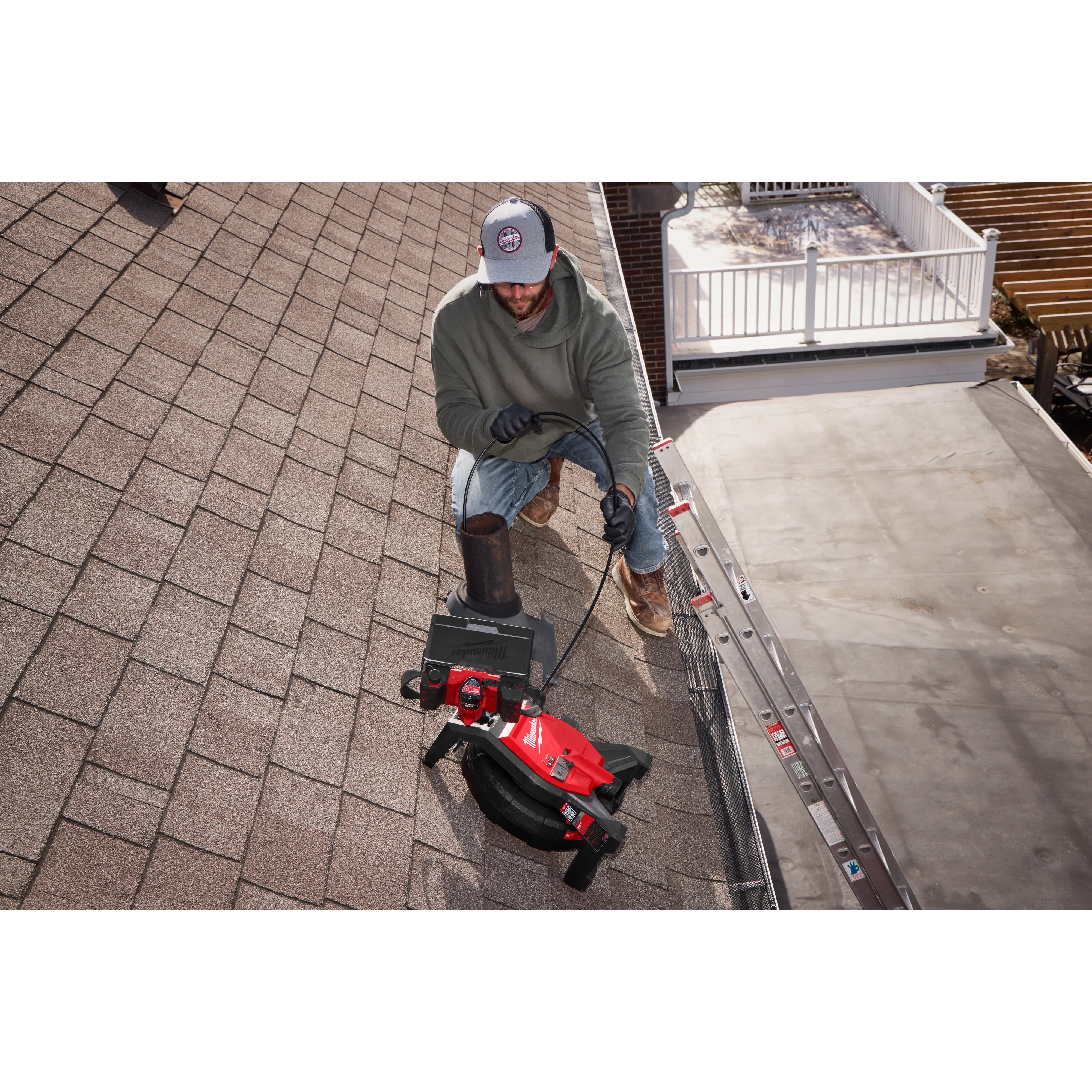 Image of a Milwaukee M12™ 85’ High Flex Compact Inspection Camera Kit being used by a worker on a jobsite