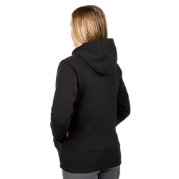 The image shows a woman from the back wearing an M12™ Women's Heated Hoodie in black. She has shoulder-length blonde hair and the hoodie features a hood and long sleeves.