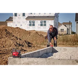 Image of the M12™ Green 360° 3-Plane Laser w/Automatic Alignment & Receiver being used on the jobsite